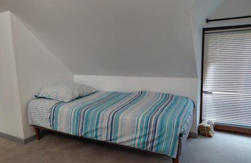 Baule House | Chambre sous les toits