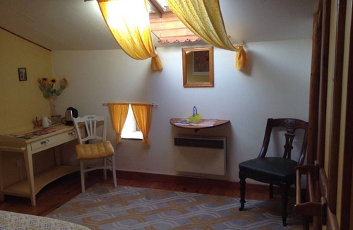 Polignac Bed & Breakfast | “Chambre Tournesols” Guest Room with Shared Terrace, Garden, and Wi-Fi