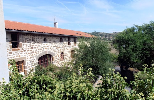 Polignac Bed & Breakfast | “Chambre Tournesols” Guest Room with Shared Terrace, Garden, and Wi-Fi