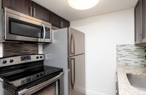 Coral Heights Apartment | Charlie Chaplin - A Timeless Modern Escape!