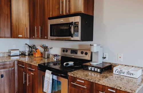 The Gate Apartment | Charming 1BR Retreat Opposite SSM SLU Hospital with Private Parking & Balcony