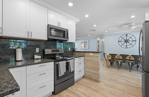 Tequesta House | Charming 4-Bedroom Beach Bungalow with Idyllic Pool & Backyard