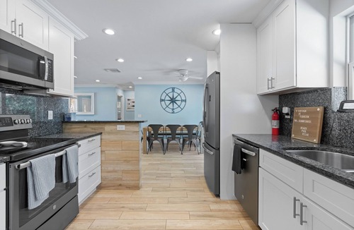 Tequesta House | Charming 4-Bedroom Beach Bungalow with Idyllic Pool & Backyard