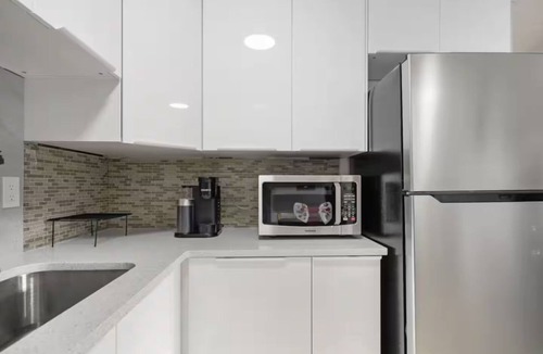 Montgomery House | Charming 4-bedroom house with AC in vibrant Calgary