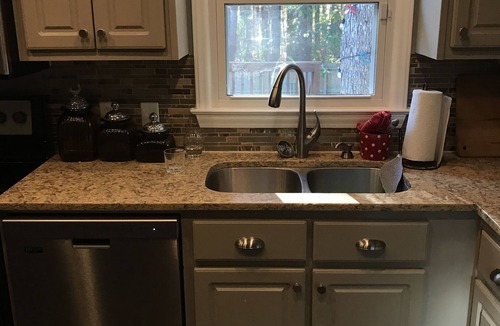 Hillsborough House | Charming brick ranch with spacious fenced yard.
