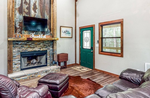 Waller Cabin | Charming cabin with hot tub, full kitchen, firepit, deck, grill, & W/D