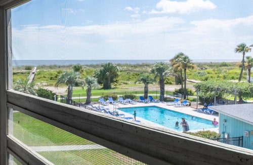 Oceanmarsh Subdivision Condo | Charming condo with a screened-in porch, water views, and access to complex pool