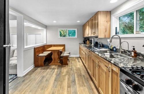 Zenda House | Charming Cottage with Firepit & Sunroom Retreat in Lake Geneva, Wisconsin