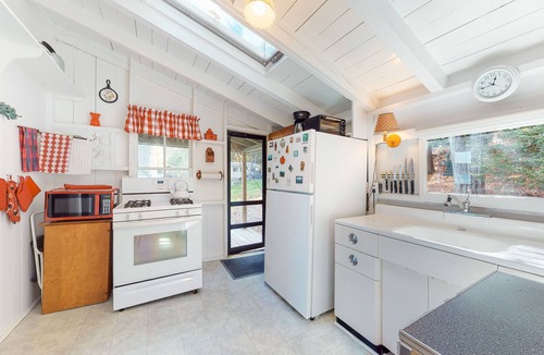 West Alton Cottage | Charming dog-friendly lakefront cottage with private dock & community beach