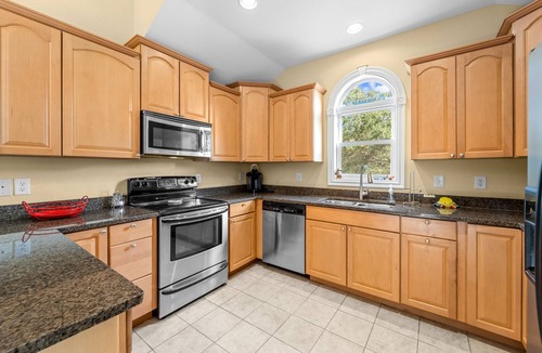 Southern Shores House | Charming home with wraparound balcony, central AC, full kitchen, & W/D