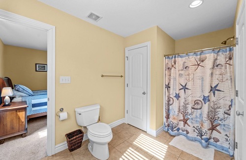 Southern Shores House | Charming home with wraparound balcony, central AC, full kitchen, & W/D