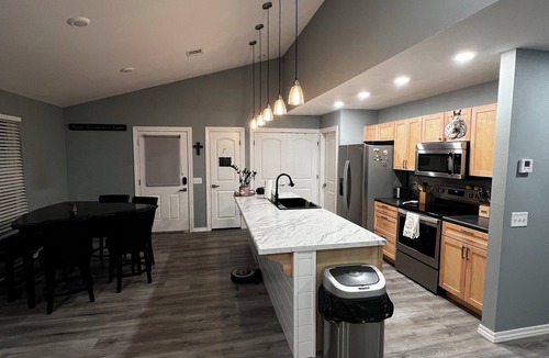 Joplin House | Charming home with firepit, large fenced yard, pet friendly.
