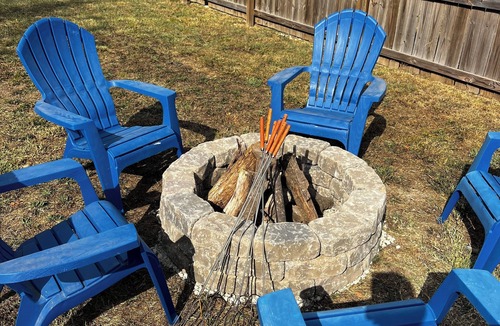 Joplin House | Charming home with firepit, large fenced yard, pet friendly.