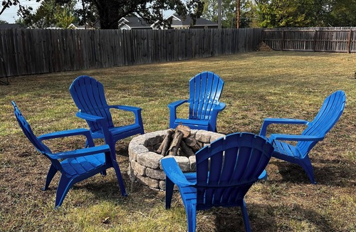 Joplin House | Charming home with firepit, large fenced yard, pet friendly.