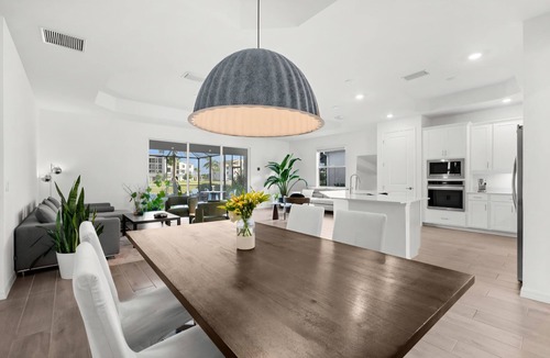 Immokalee House | Charming lakeside home with pool, spa and modern coastal design.