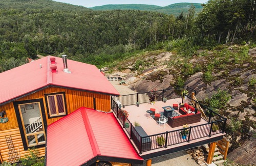 Mandeville Cabin | Charming log cabin nestled in the woods, with a spa and in-ground pool.