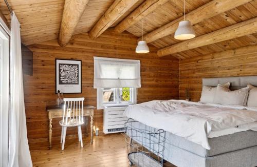 Bøtø By House | Charming Log Cabin Near The Sea