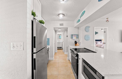 Pass-a-Grille Historic District Condo | Charming Pass-a-Grille beachfront condo, St. Pete Beach, heated pool, laundry