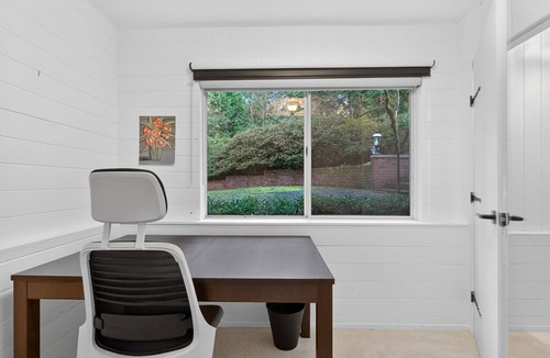 West Hills House | Charming Portland Getaway Backyard Library