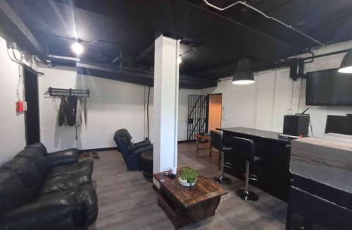 Sault Ste. Marie Apartment | Charming Prohibition-Era Speakeasy Lounge with Bedroom and Commercial Kitchen