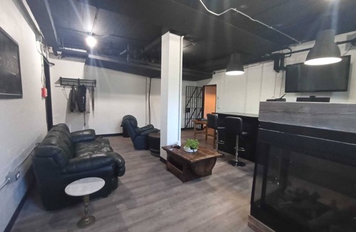 Sault Ste. Marie Apartment | Charming Prohibition-Era Speakeasy Lounge with Bedroom and Commercial Kitchen
