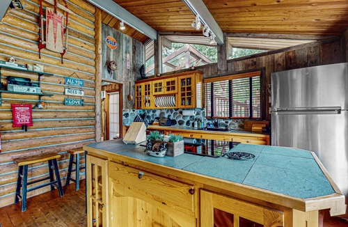 Gold Bar House | Charming riverfront cabin with hot tub, deck, mountain views and W/D