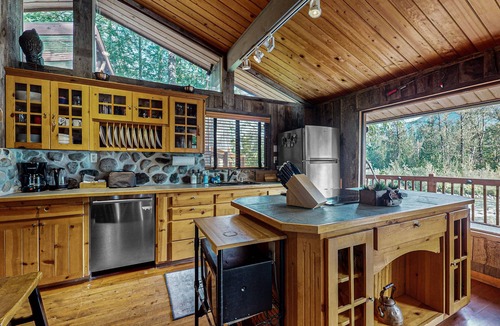 Gold Bar House | Charming riverfront cabin with hot tub, deck, mountain views and W/D