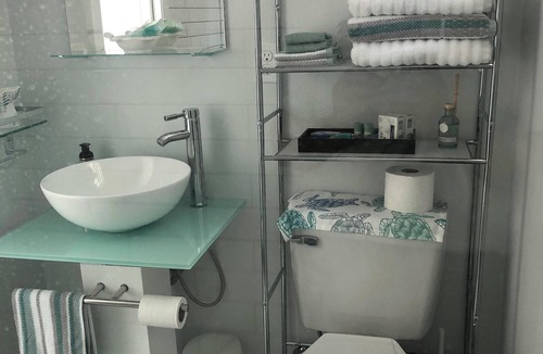 Cookson House | Charming shipping container home with lake view and boat ramp.