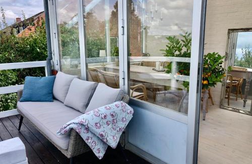 Randers Apartment | Charming sunroom with panorama view