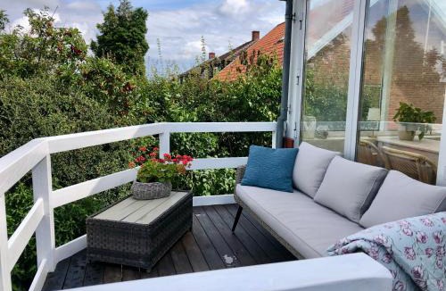 Randers Apartment | Charming sunroom with panorama view