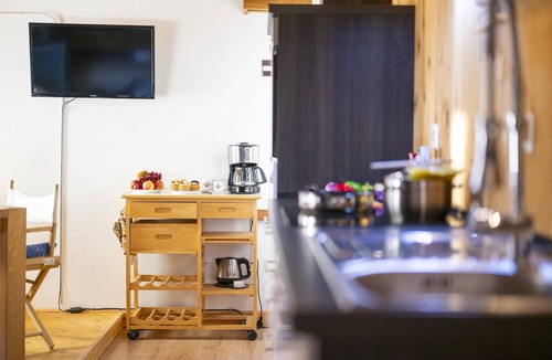 Valsot Apartment | Chasa Patgific: Cozy 3-Room Holiday Apartment with Wood Stove and Stunning Garden in Ramosch