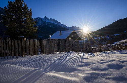 Valsot Apartment | Chasa Patgific: Cozy 3-Room Holiday Apartment with Wood Stove and Stunning Garden in Ramosch