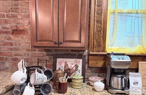 Warrensburg Apartment | Chateau Du Burg-Historic 1bd, downtown, dog friendly, free breakfast and coffee