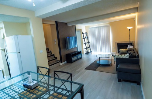 Southeast Calgary House | Cheerful 2 bedroom townhome with fireplace