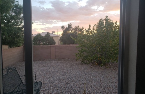 Paradise Hills Civic House | Cheerful NM style home with indoor fireplace