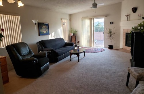 Paradise Hills Civic House | Cheerful NM style home with indoor fireplace