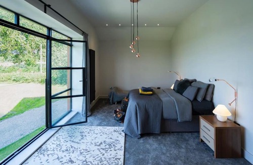 Sutton House | Cheshire Barn. views, bbq, fire pit, TV, Wifi