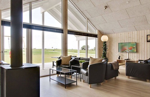 Skastrup Strand House | Chic pool and activity house with 5 bedrooms, 2 bathrooms, fireplace and WiFi