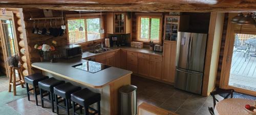 Kalispell House | Christys Cottage Waterfront with slide and Ice Shanty