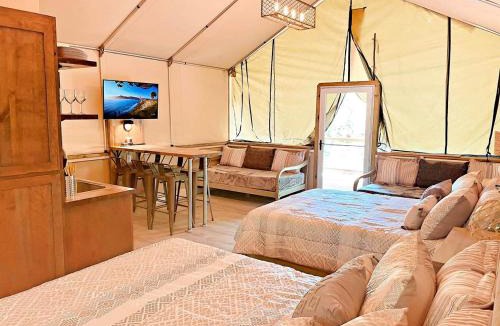 Sutherland Springs House | Cibolo's Family Oasis: Waterfront Tented Cabin Fully Loaded for Your Perfect Getaway