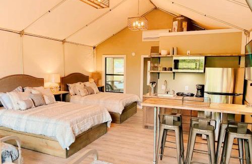 Sutherland Springs House | Cibolo's Family Oasis: Waterfront Tented Cabin Fully Loaded for Your Perfect Getaway
