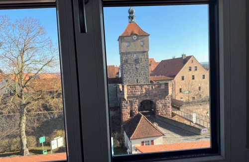 Wolframs-Eschenbach Apartment | City Side Junior Suite Loft with a view of the historic Upper Gate