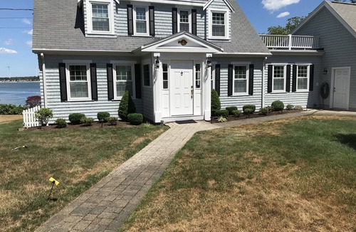 Buzzards Bay House | Classic cape on a hill over looking buttermilk bay