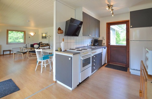 Knubbeløkke House | Classic, Danish cottage near the water.