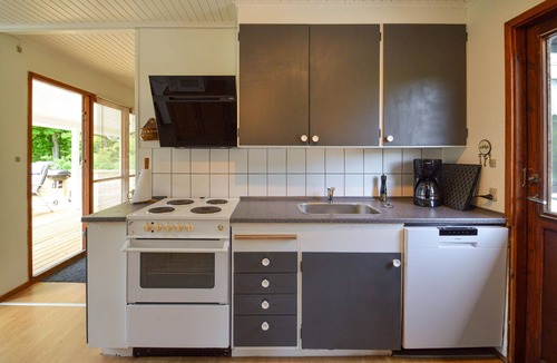 Knubbeløkke House | Classic, Danish cottage near the water.