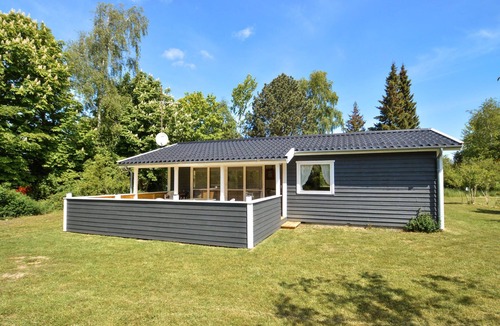 Knubbeløkke House | Classic, Danish cottage near the water.