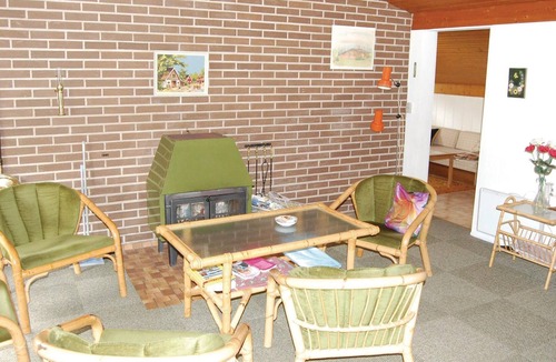 Gedesby House | Classic, practically furnished brick vacation home with inviting, fenced terraces and situated on be