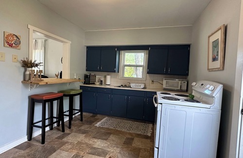 McPherson House | Clean 2 bedroom bungalow with comfortable furniture and a gaming table!