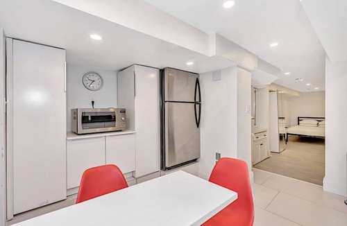 East Danforth House | Clean, white, bright and close to Woodbine subway