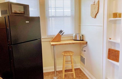 Clintonville Apartment | Clintonville Gem Fireplace Modern Kitchen